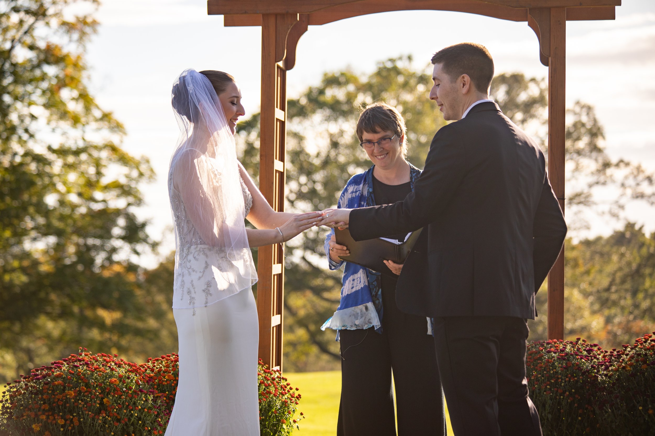 Burlington, Vermont outdoor wedding, ring exchange, Martha Dallas, officiant