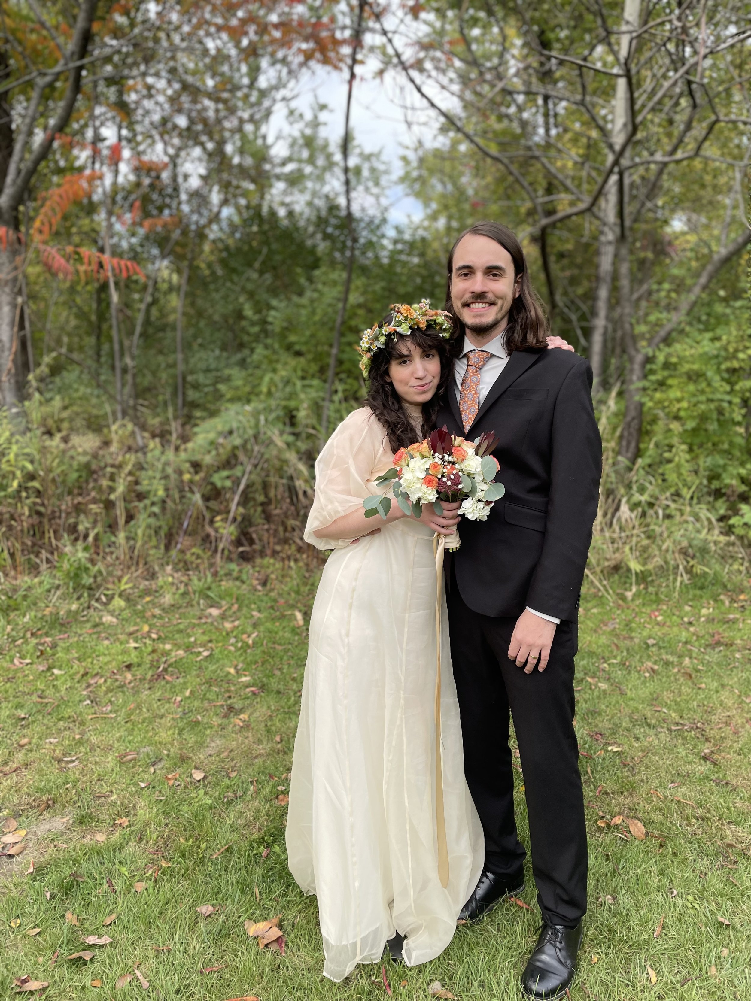 Couple in grassy field, Winooski, Vermont. Martha Dallas, officiant