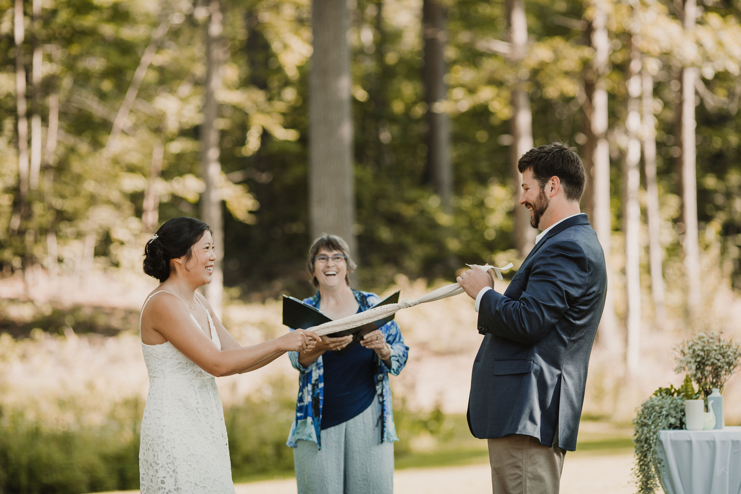 These college sweethearts had their siblings present the ribbons for the handfasting in their Adirondack wedding. Image: Sloane Dakota Photo.