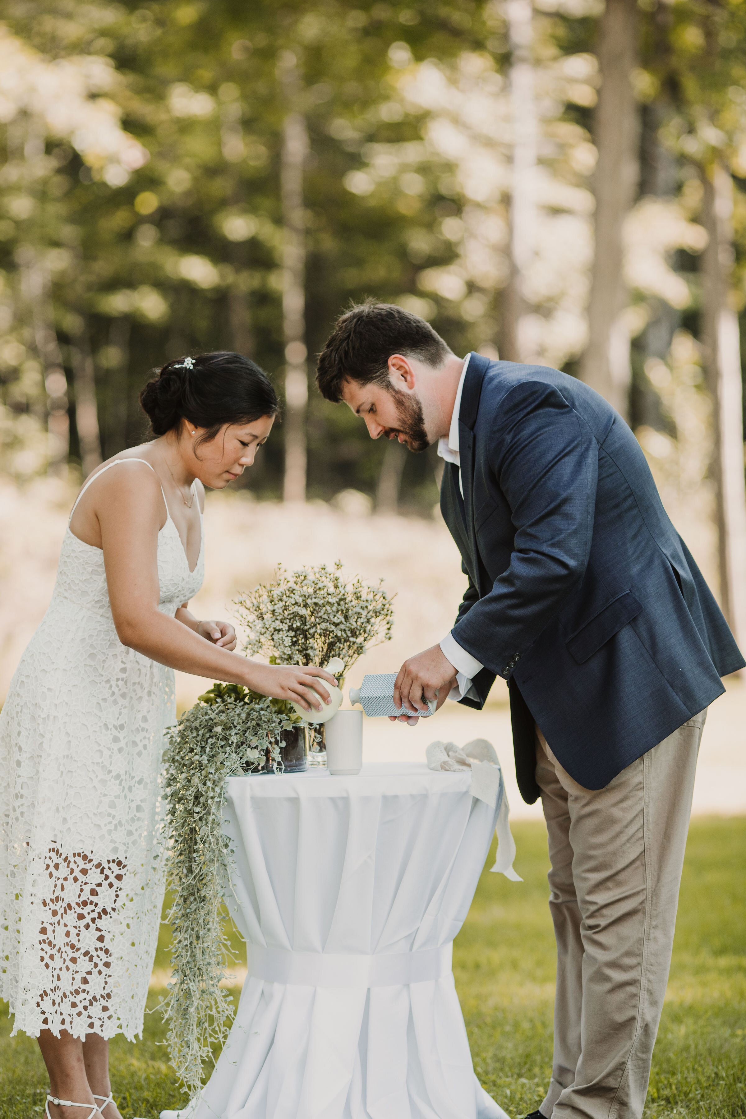 These two are pouring tea from different vessels into one cup, which they shared with each other in this classic unity ritual. Image: Sloane Dakota Photo.