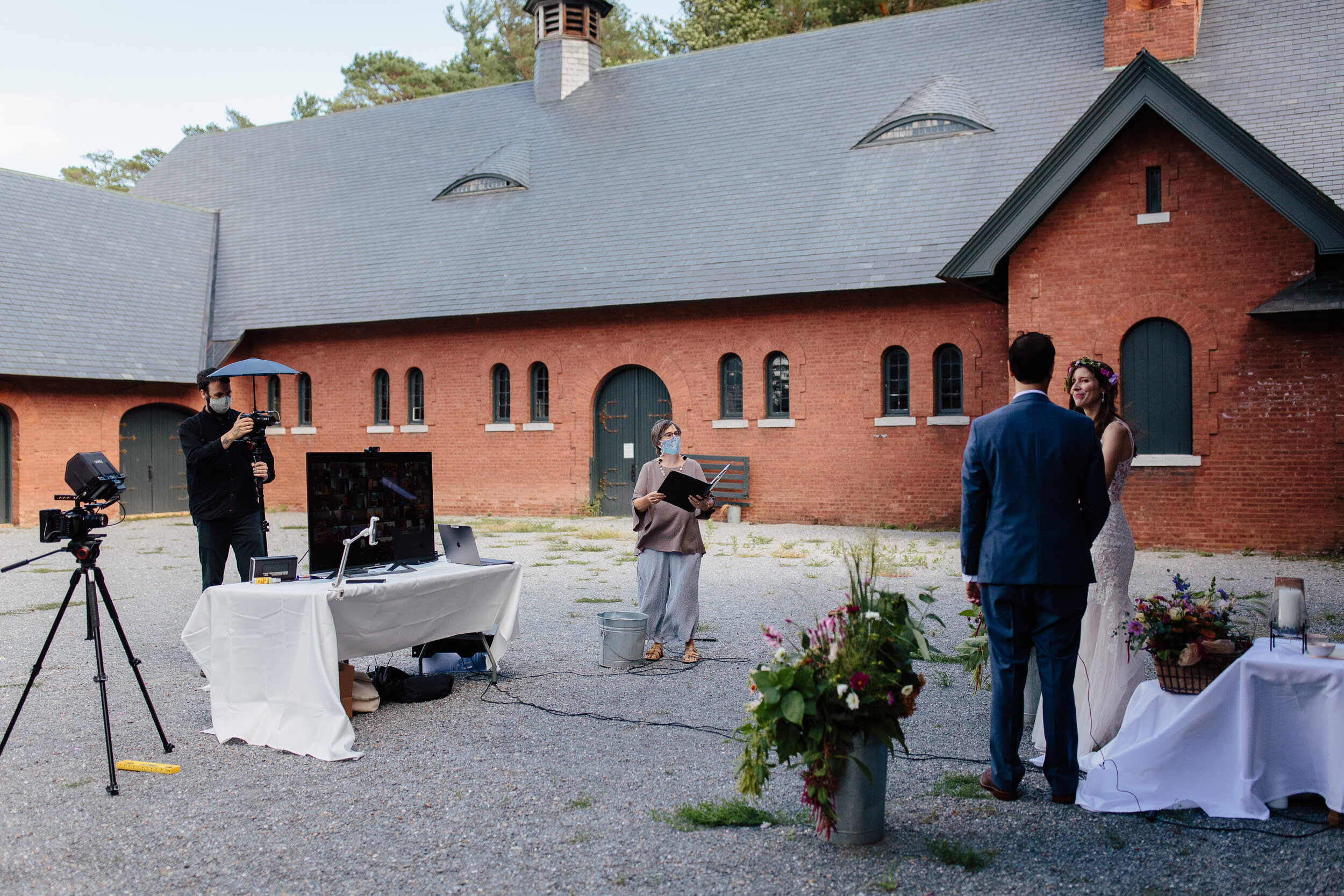 This socially-distanced wedding was held in the courtyard of Shelburne Farms’ Coach Barn and included virtual guests from eight countries and thirteen states! Image by Ellen of The Light and Color